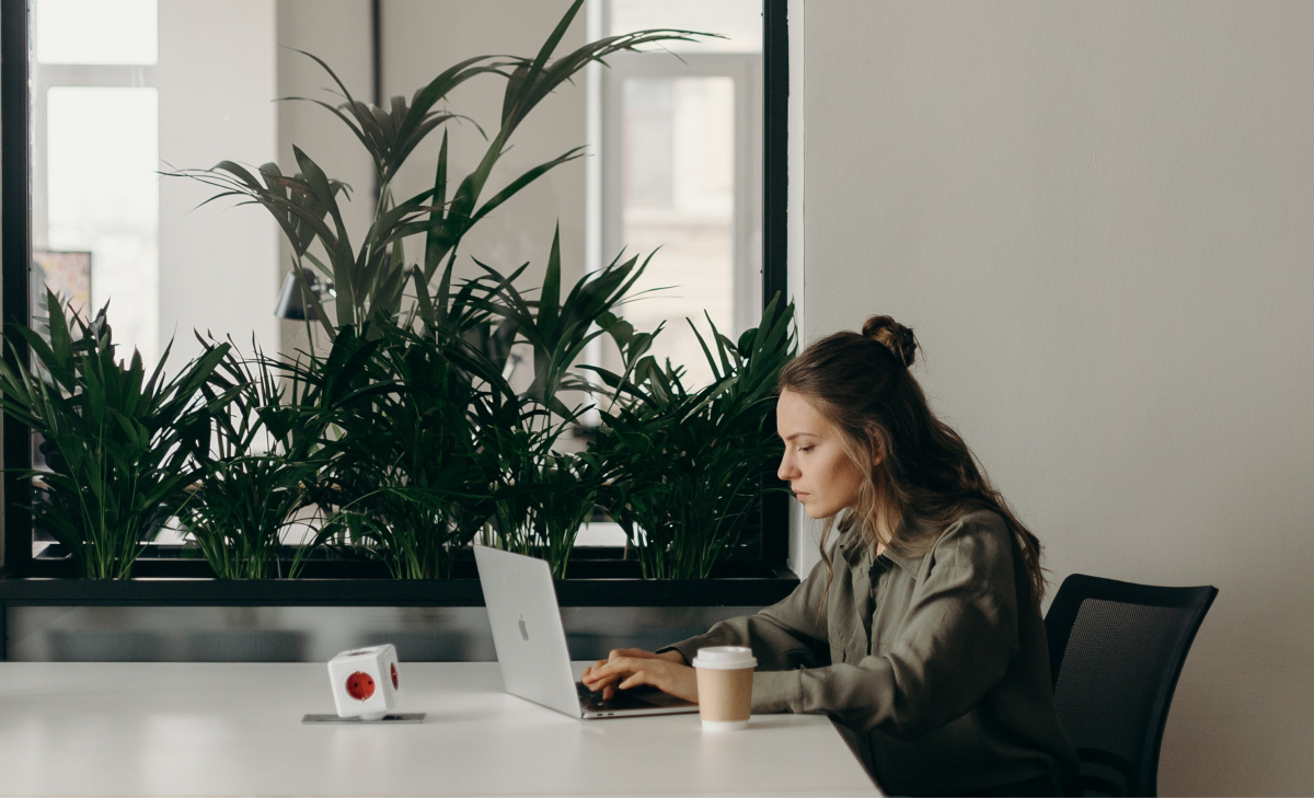 woman at table with laptop