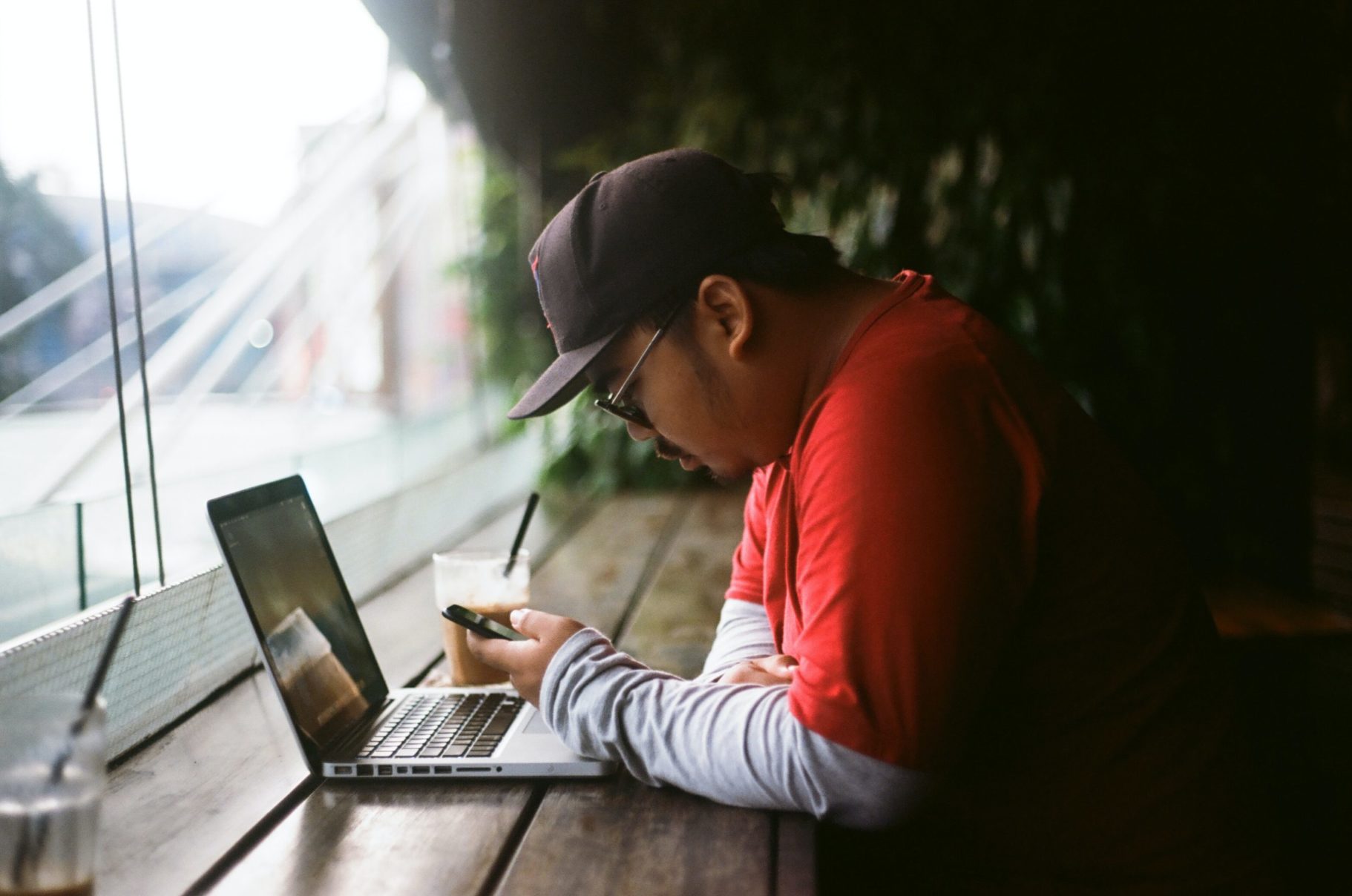 man sitting on laptop