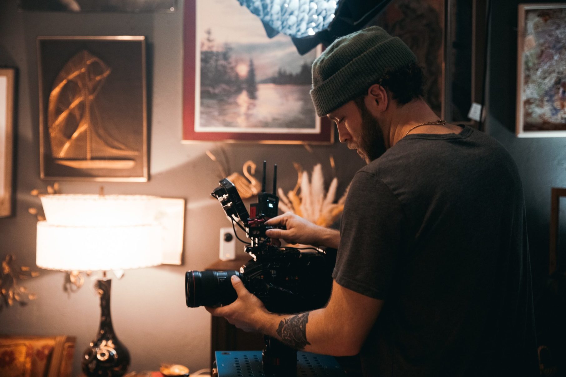 man filming in room