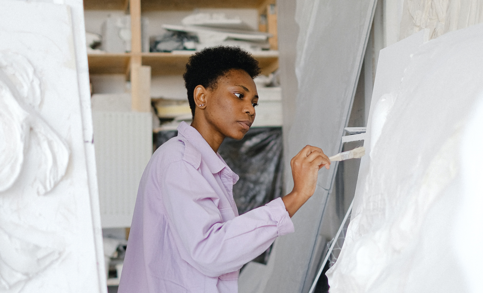 woman painting in workshop