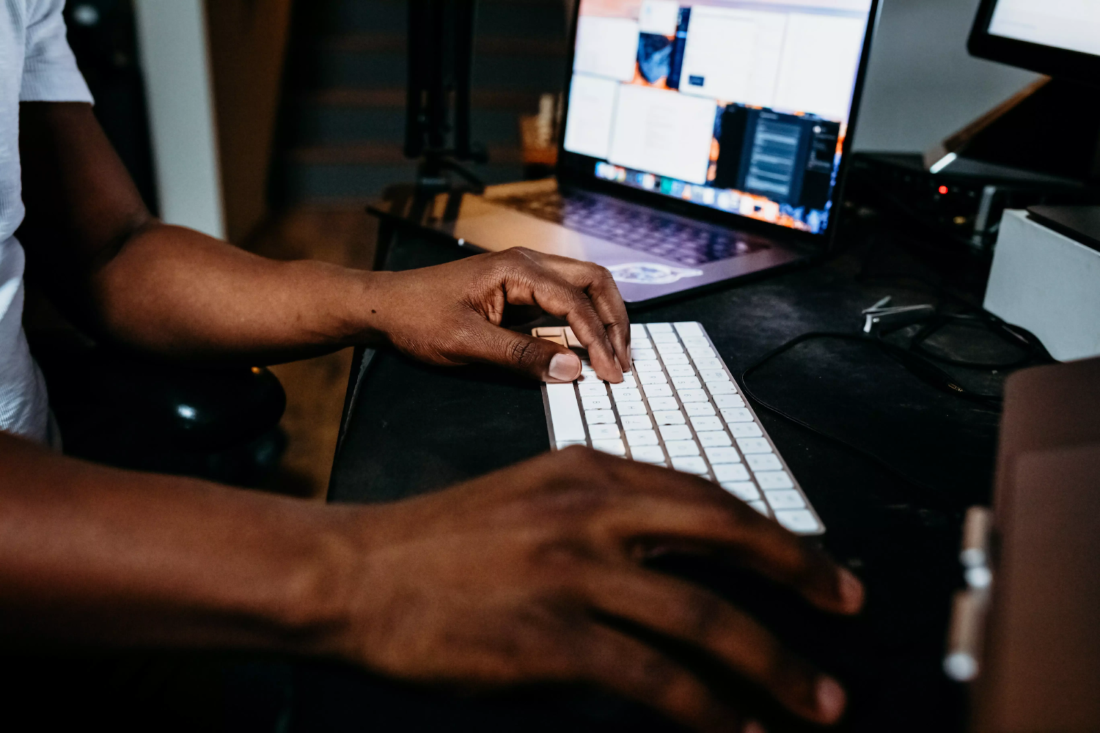 man typing on keyboard