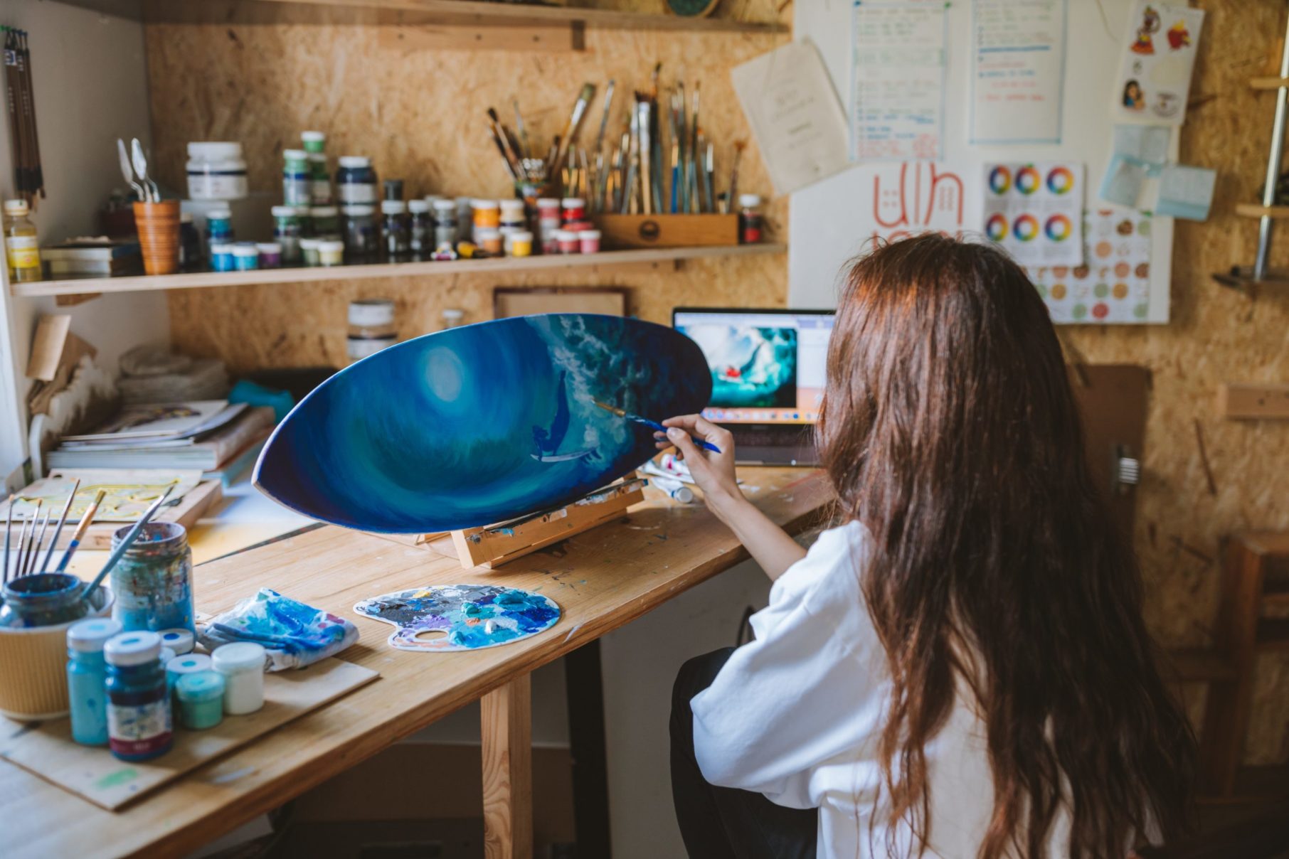 girl painting in studio