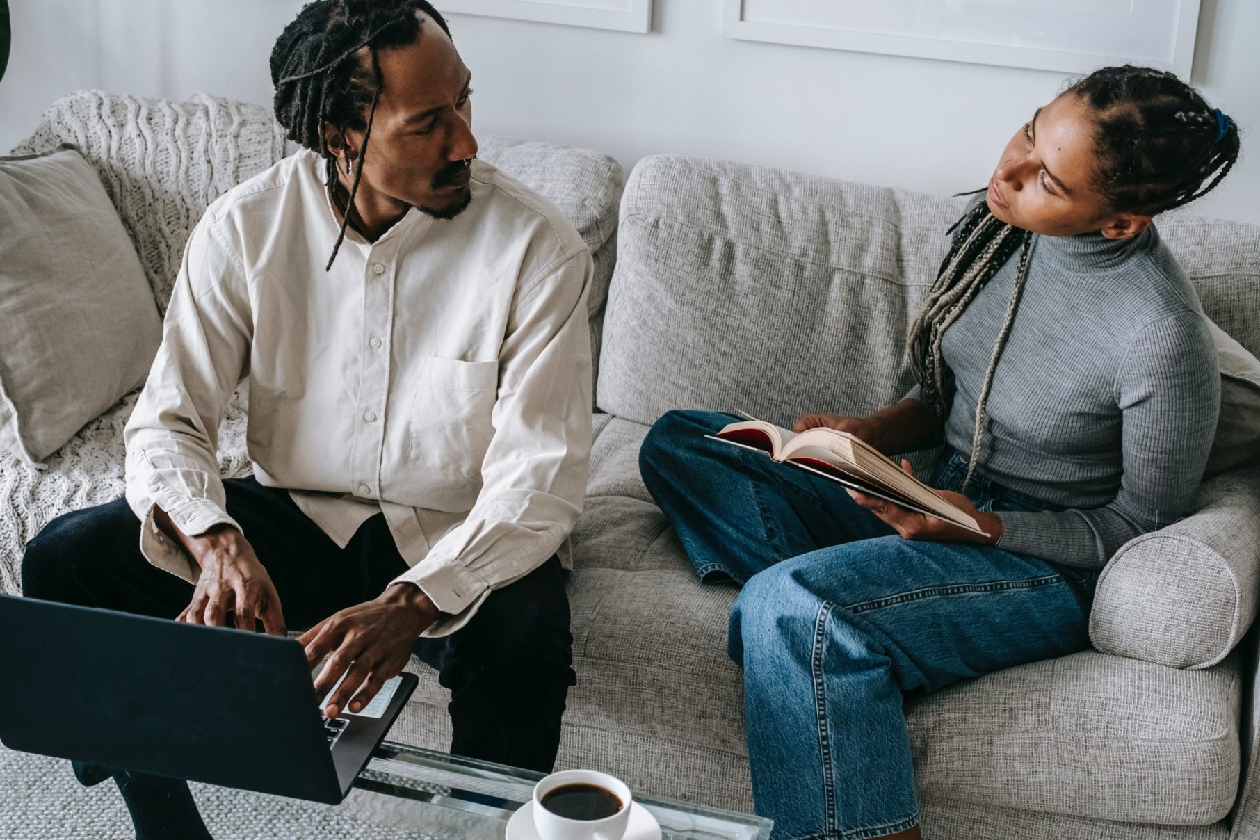 people having a meeting on a couch