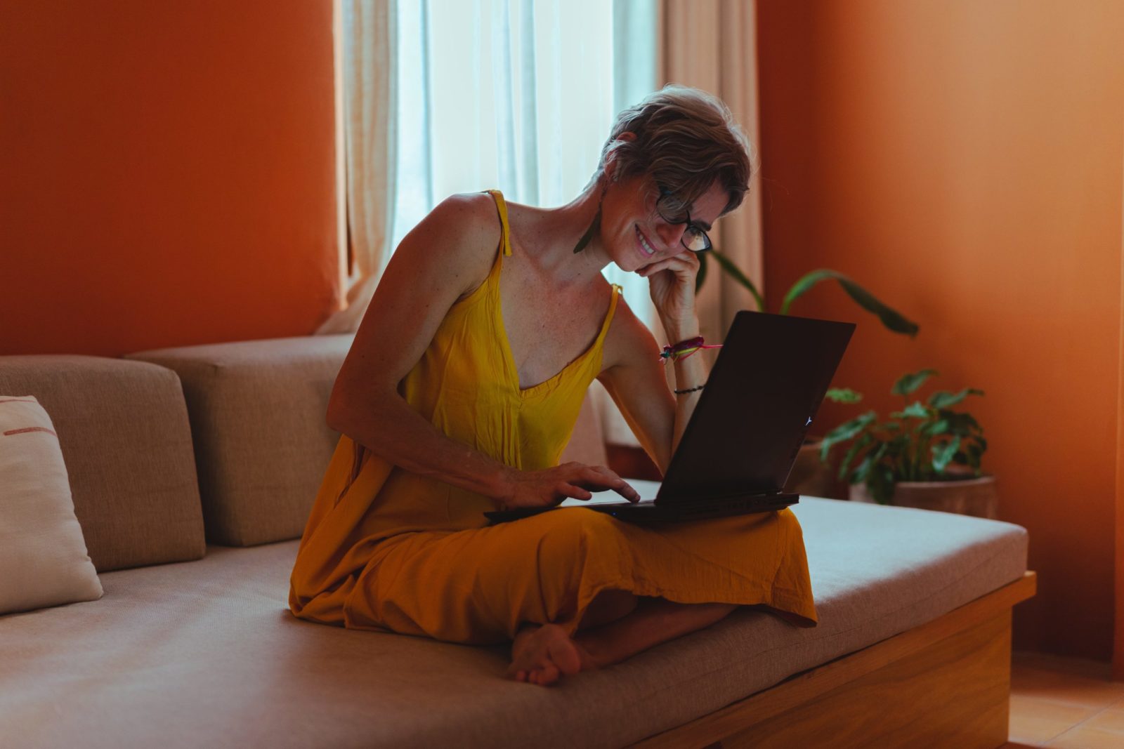 woman working on couch