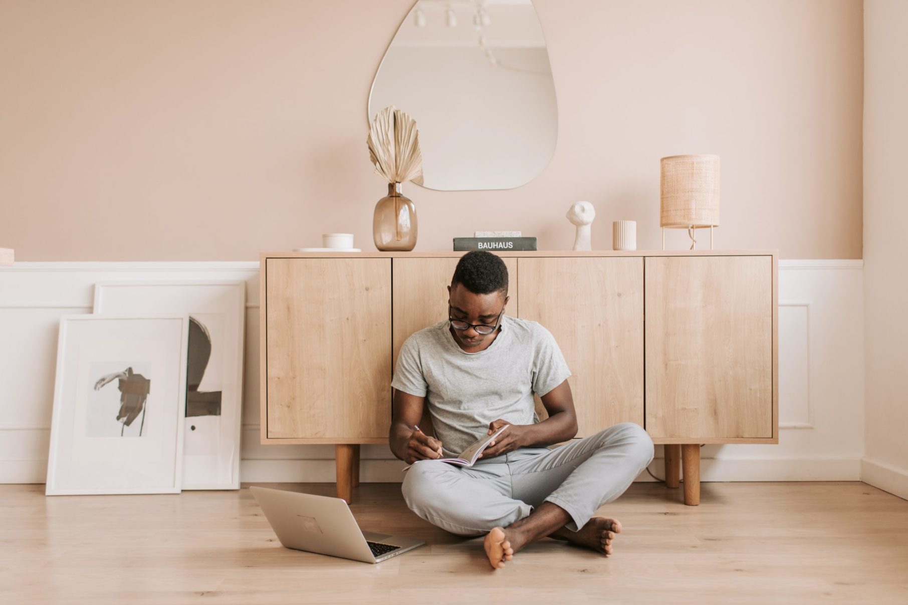 man sitting on floor working