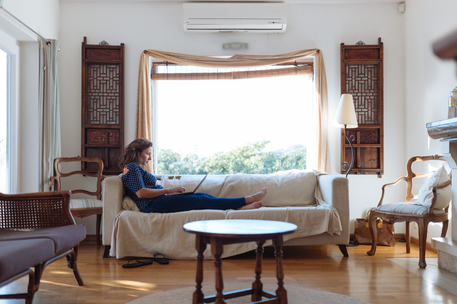 woman working on couch