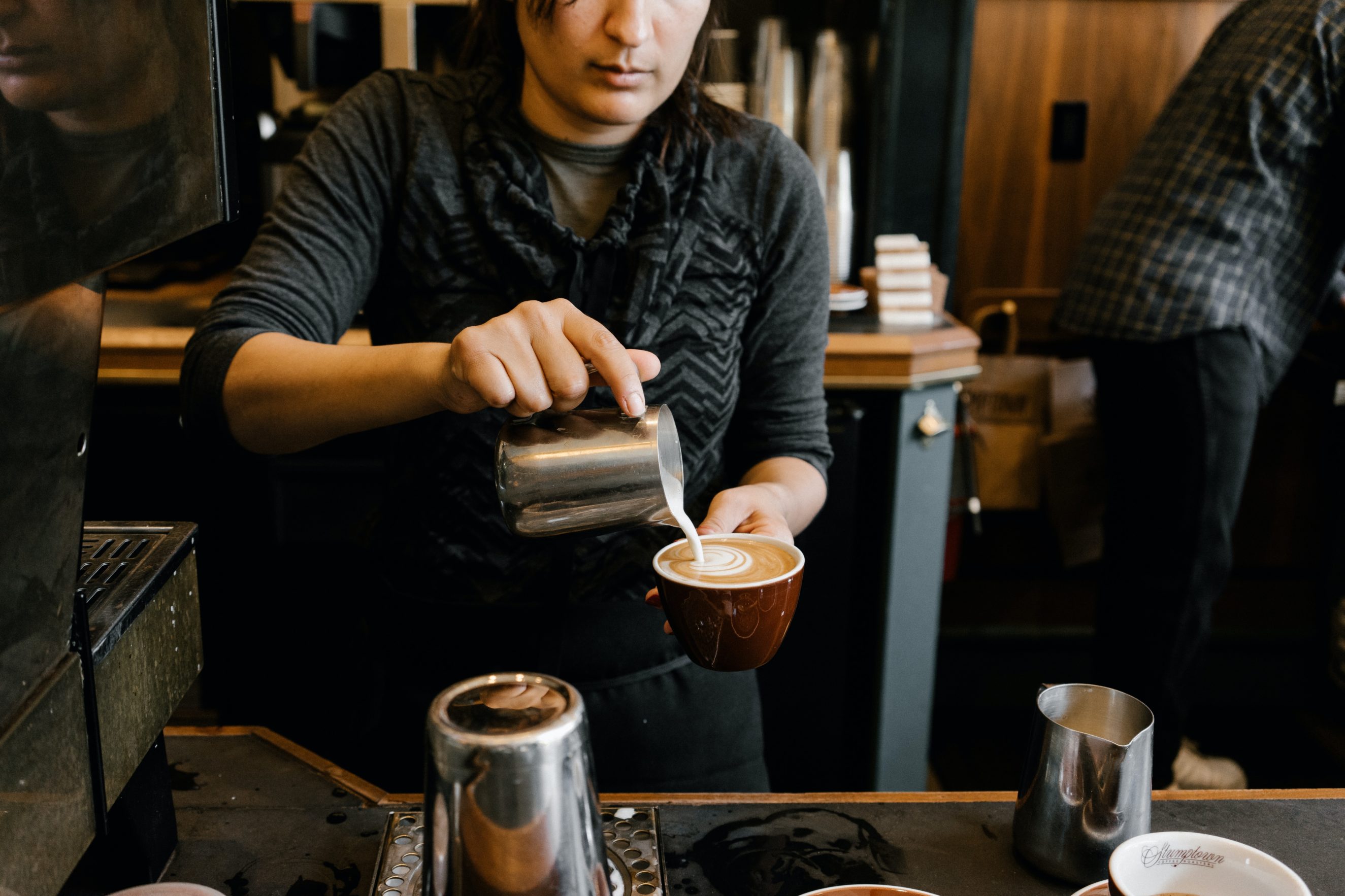 person pouring coffee