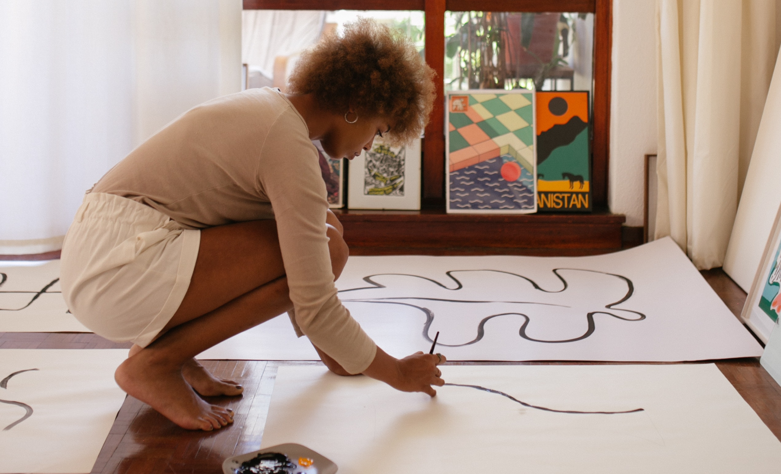 woman painting on floor