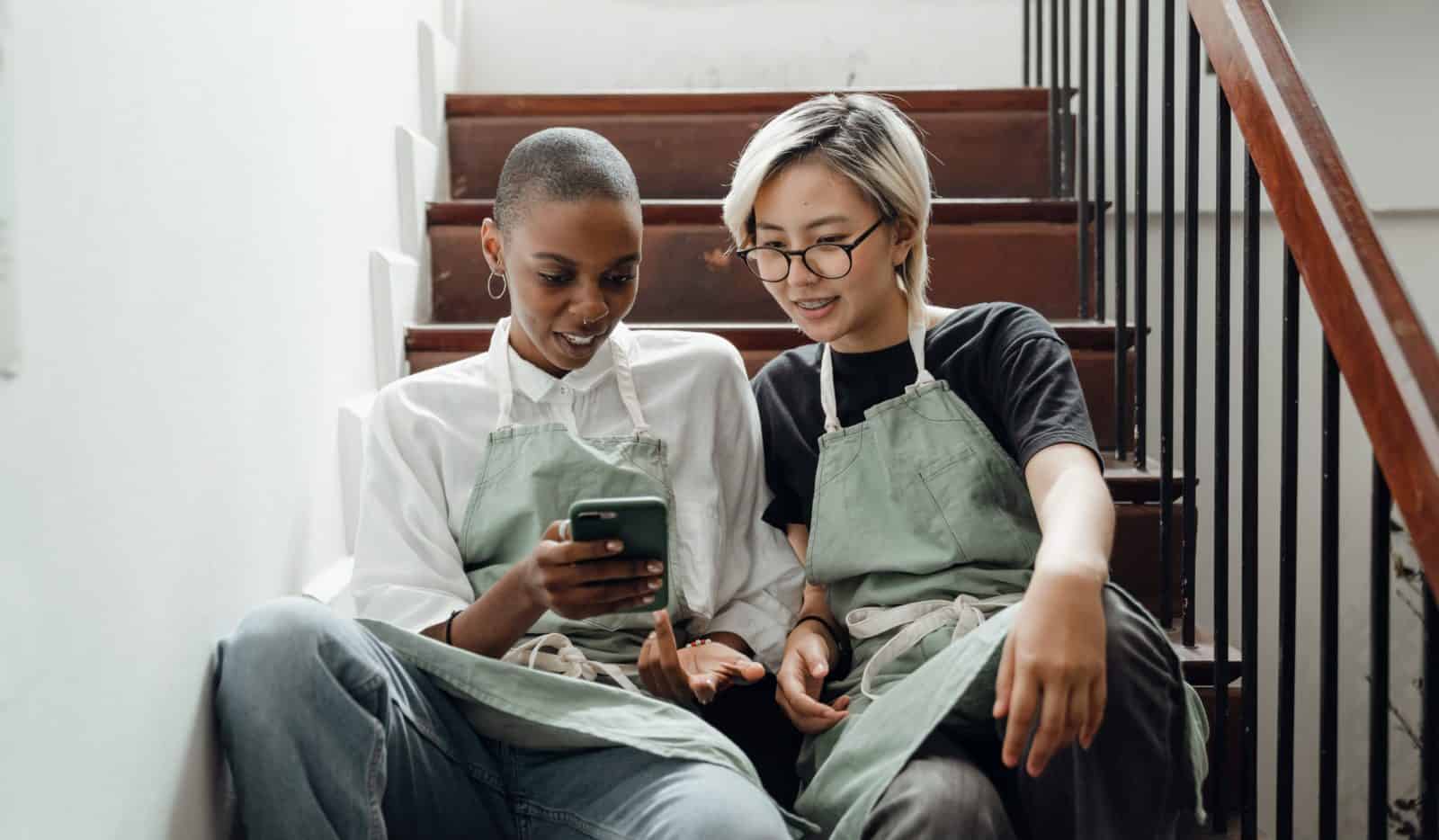 baristas looking at a phone