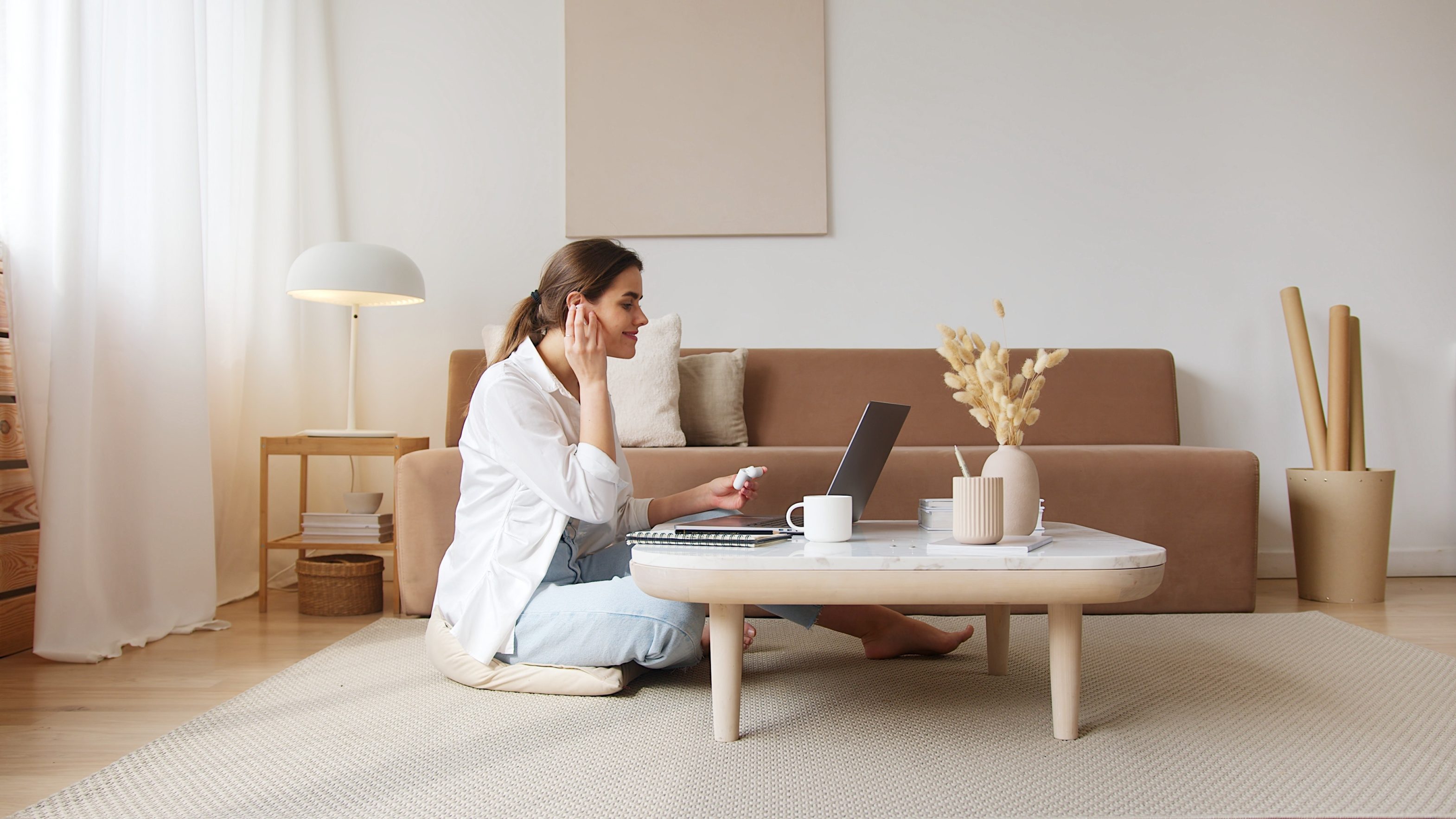 woman filming in living room