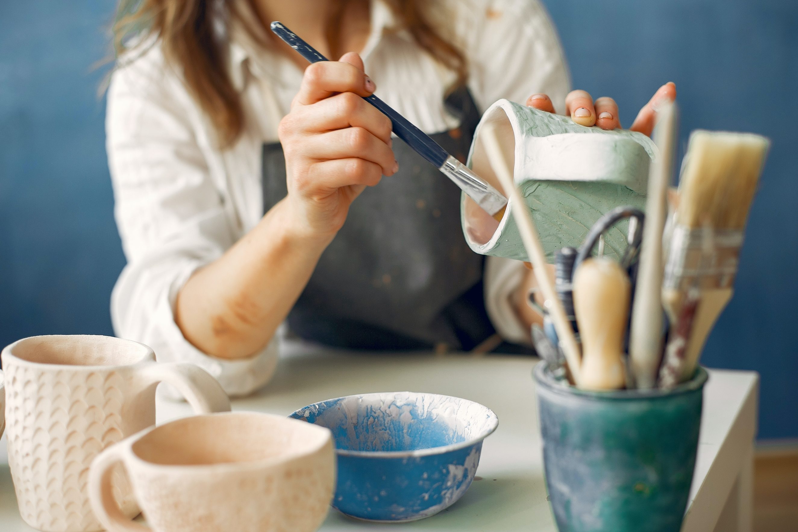 potter painting pottery