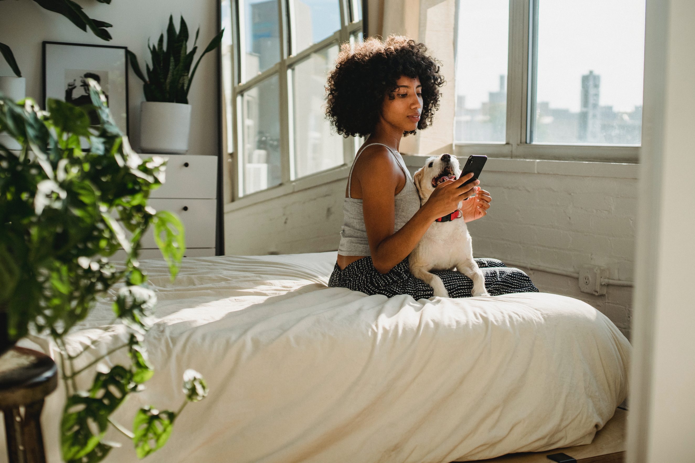 woman on phone in bedroom