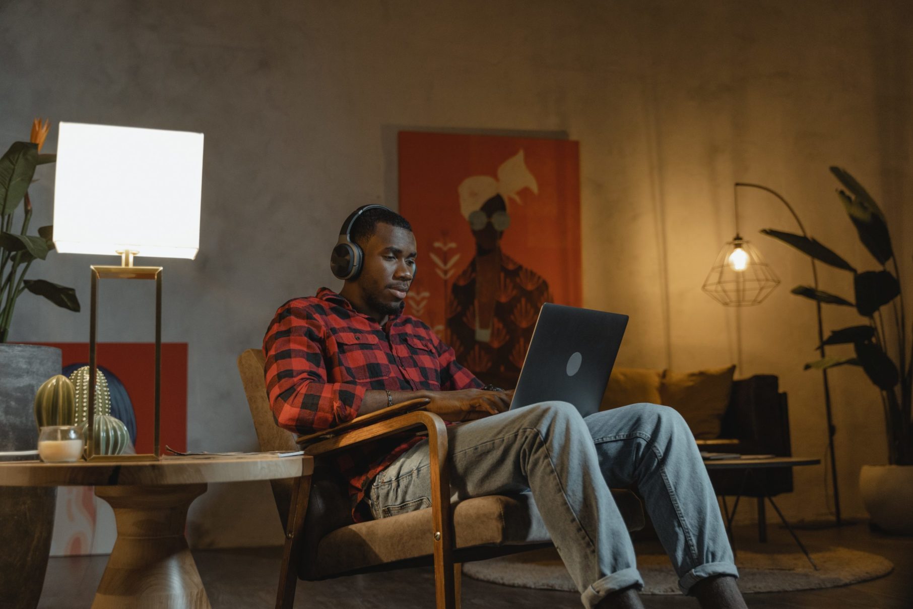 man on his computer with headphones