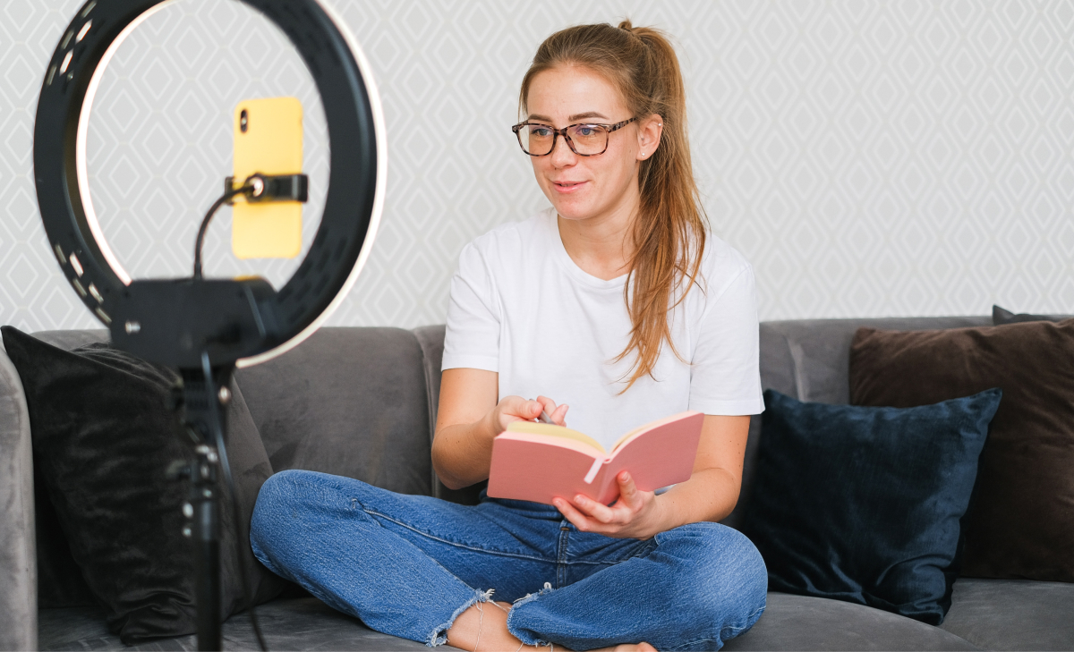 woman filming with ring light