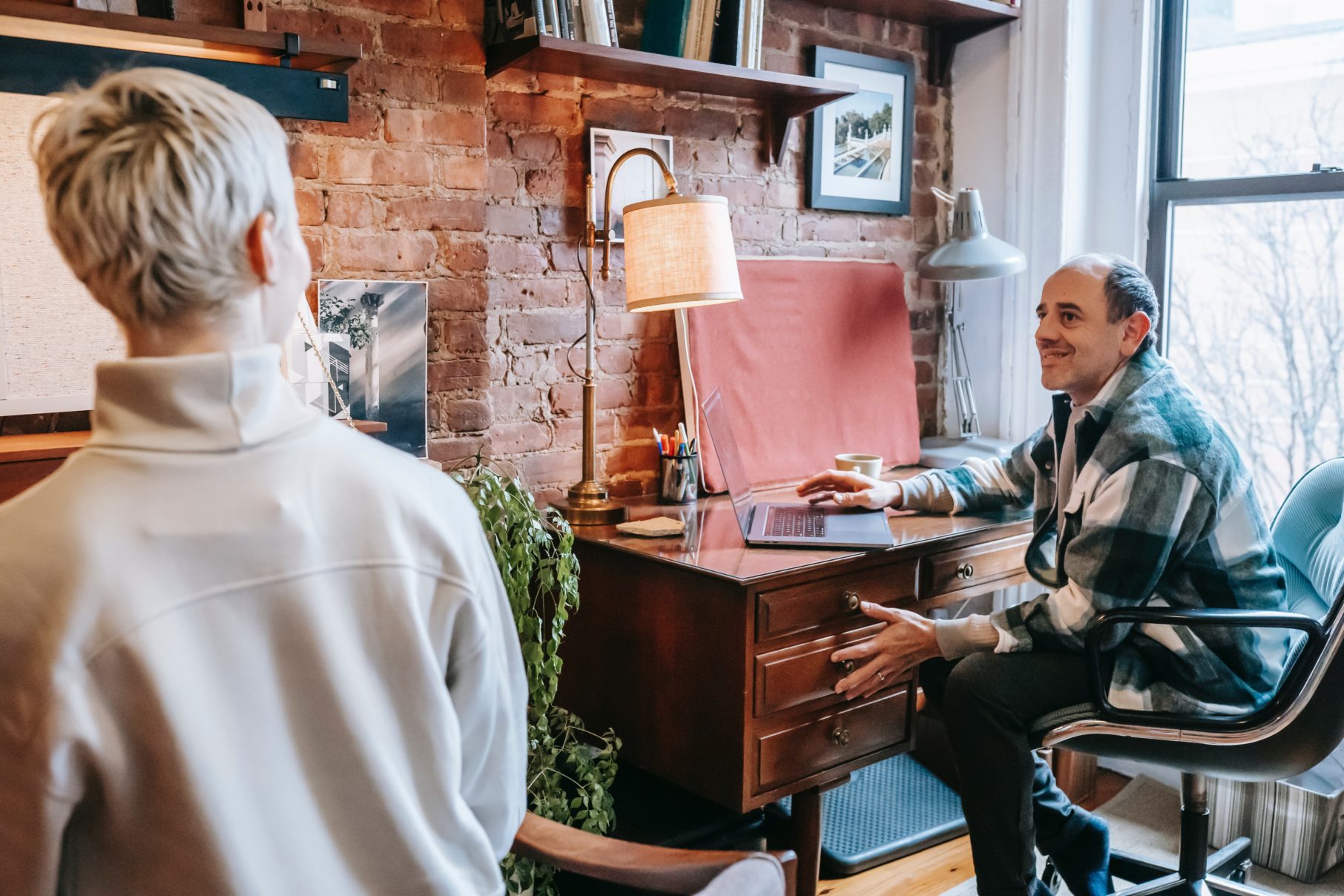 man working at computer in home office