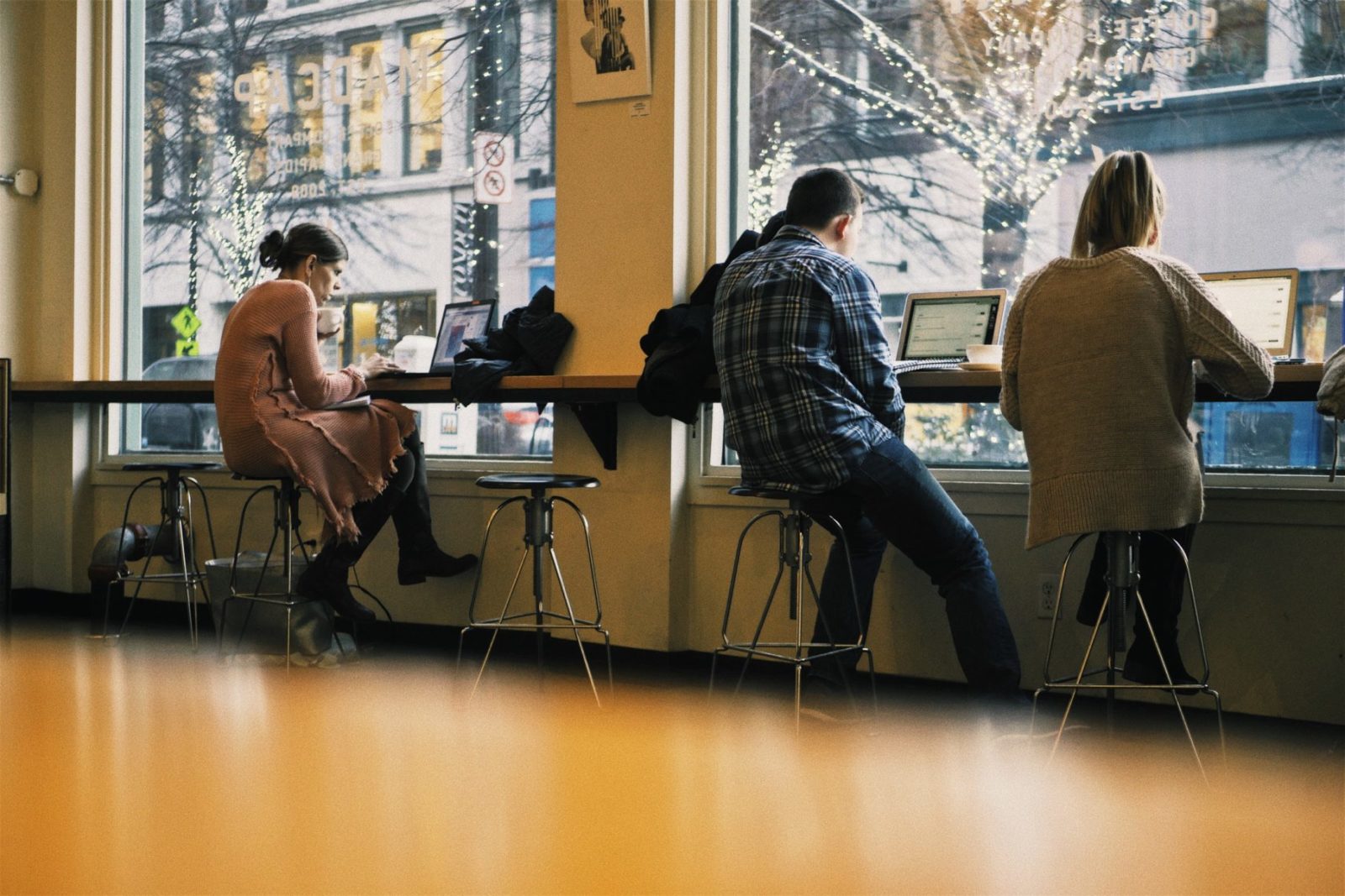 people working in cafe