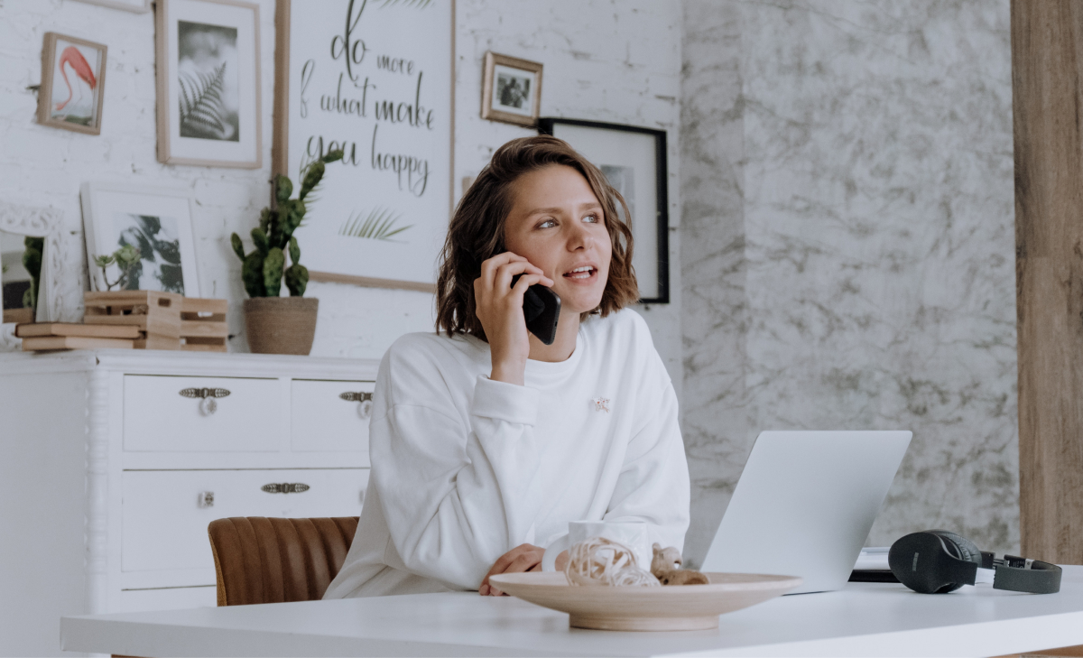 woman at home office on phone