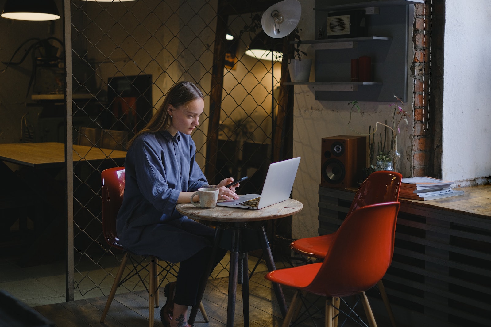 woman at table working on computer