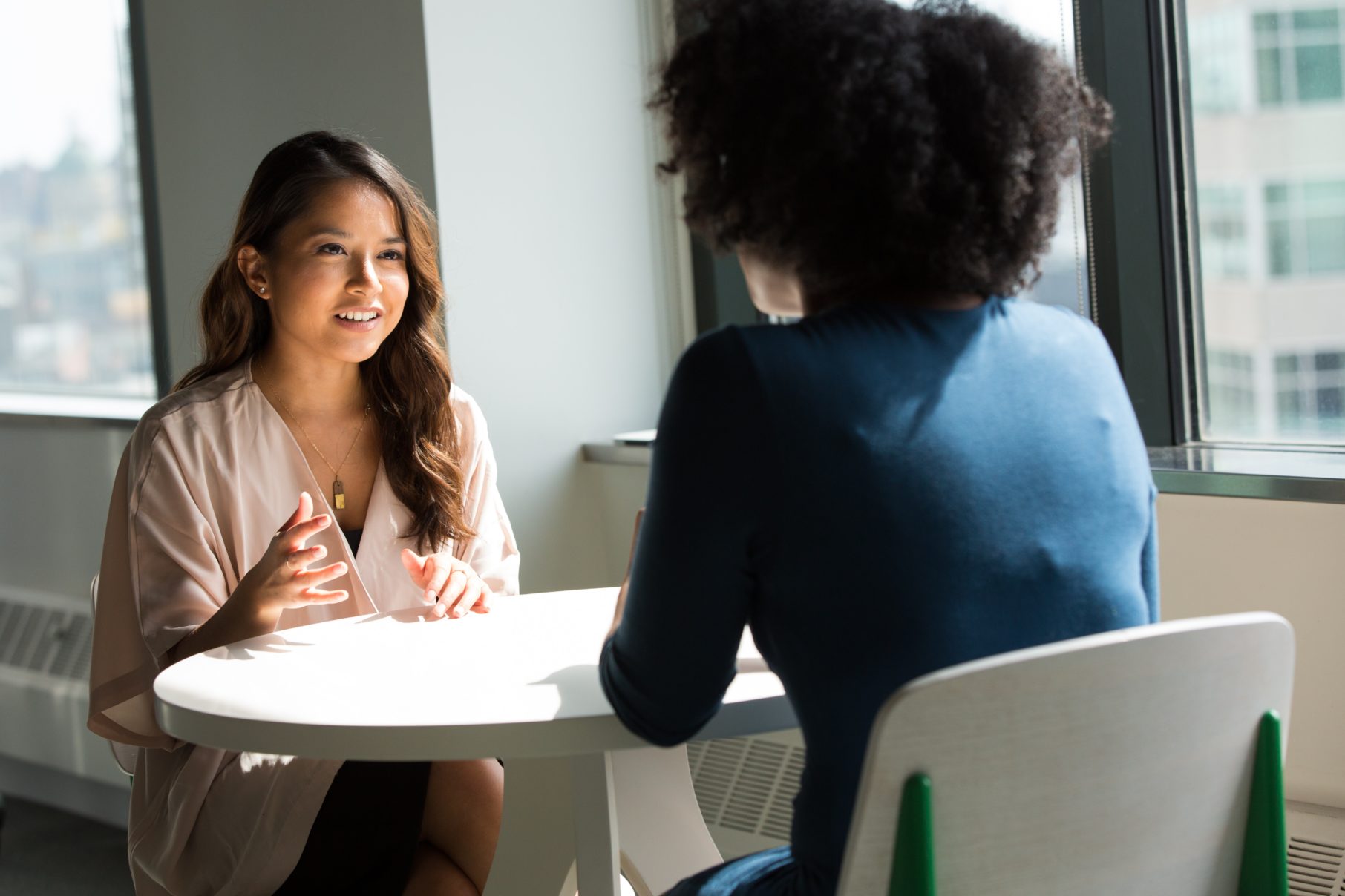 two people talking at table