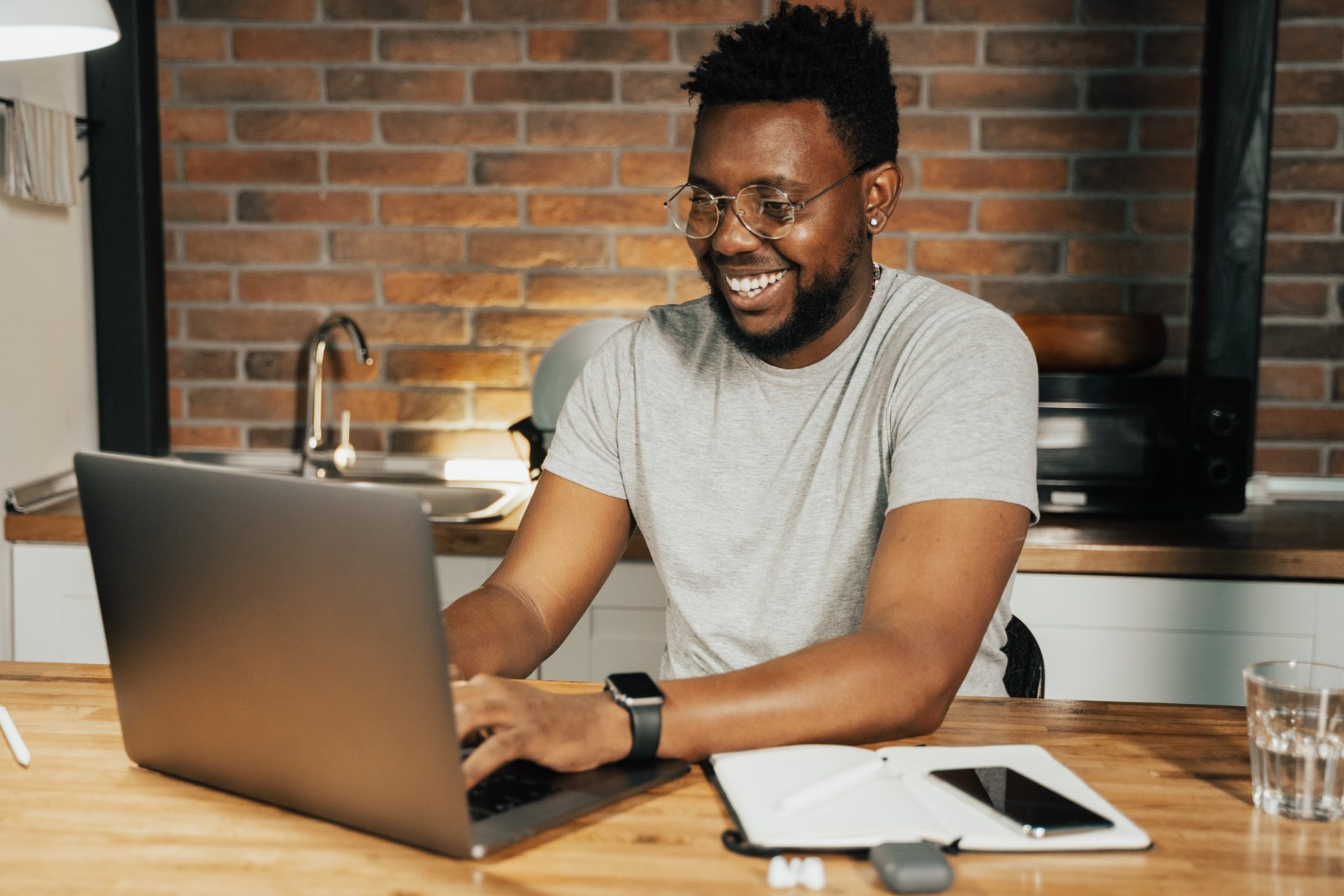 man smiling at computer