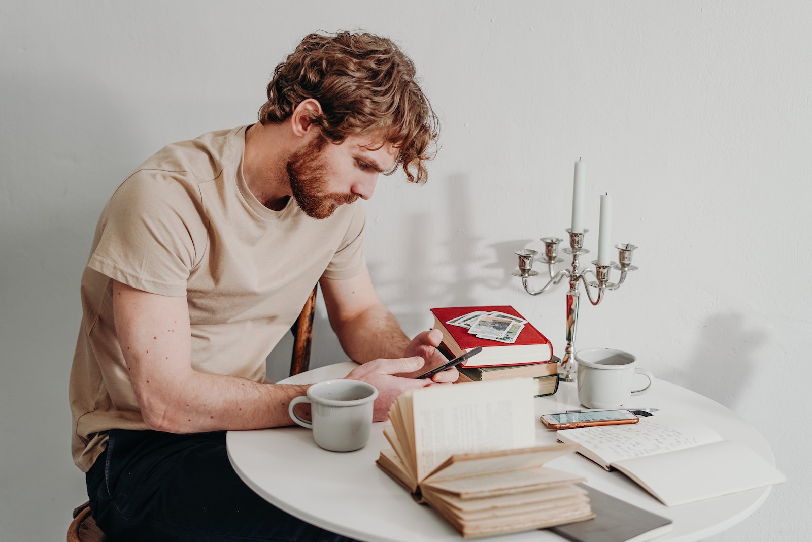 man on phone at table