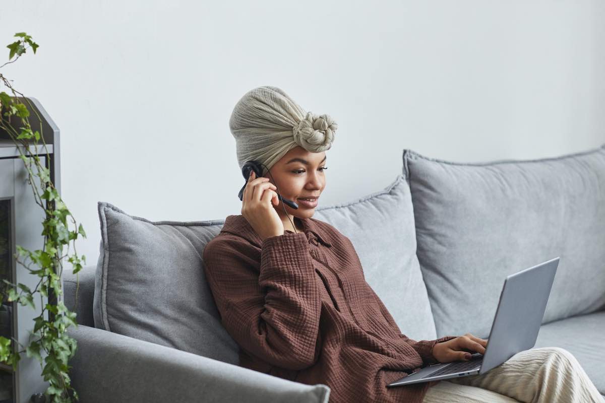 woman sitting on couch sell knowledge online