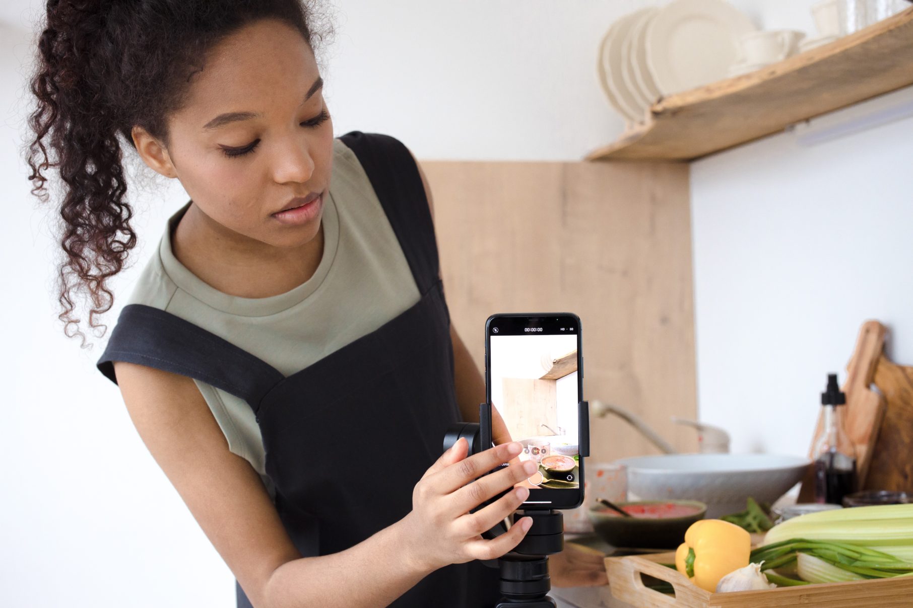 woman filming cooking tutorial