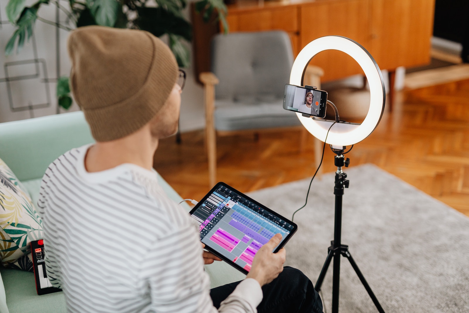 person filming with ring light