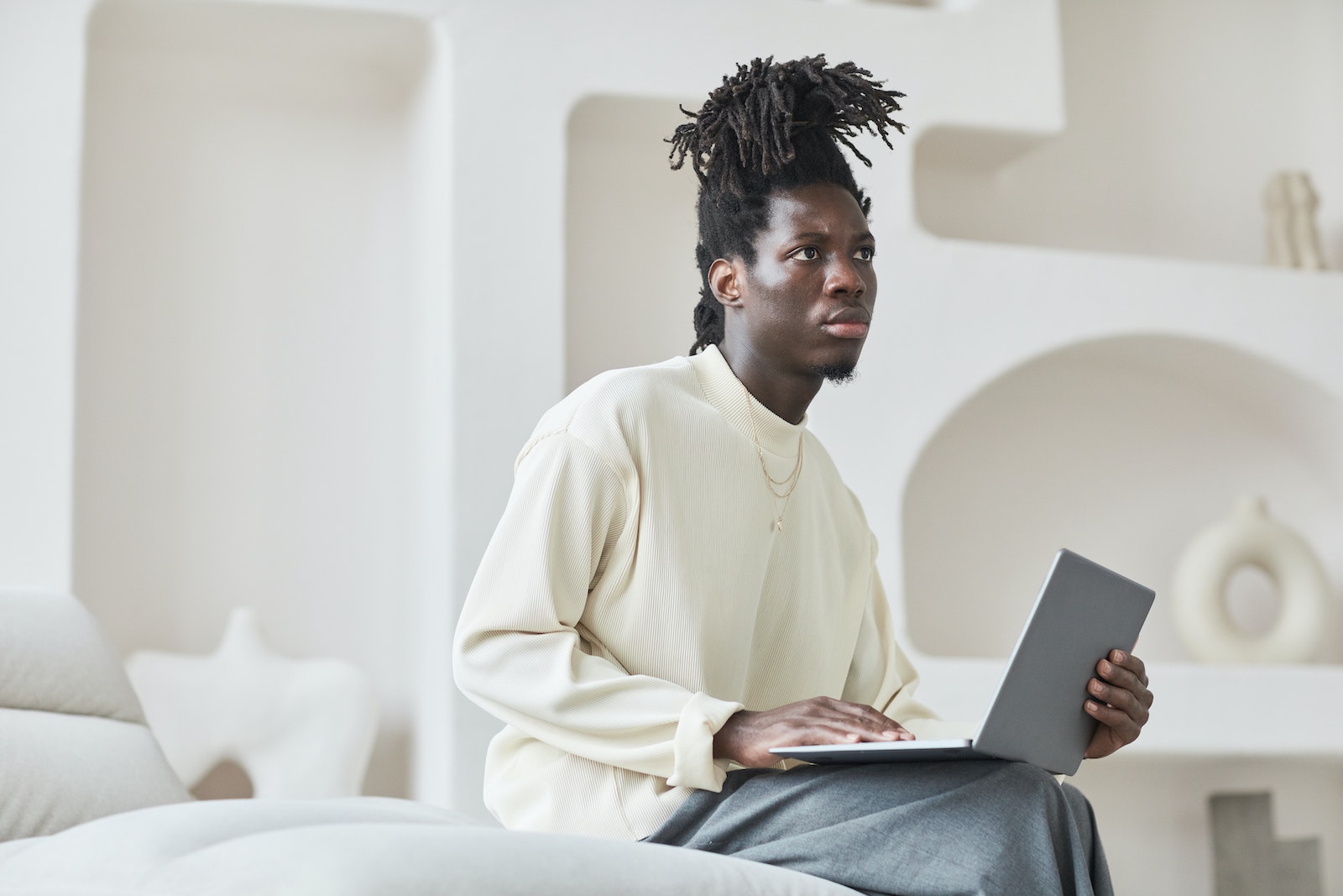 person writing at lap top