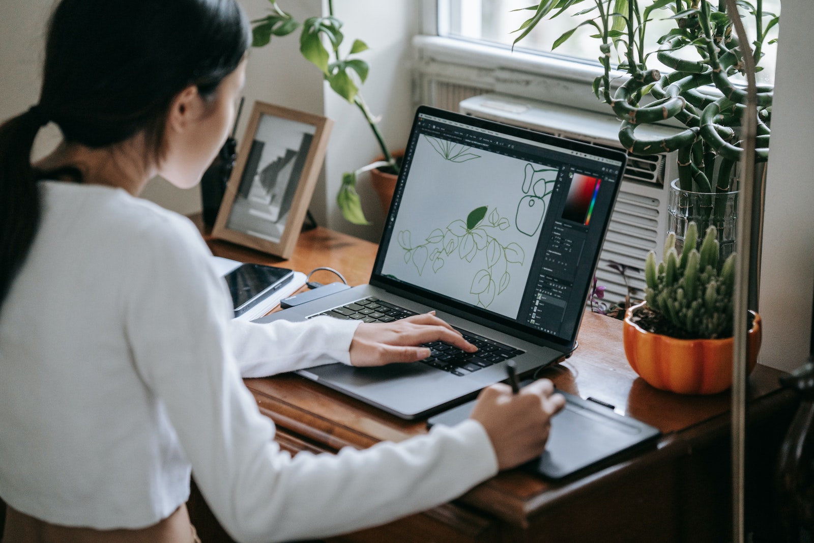 woman working on illustration at computer