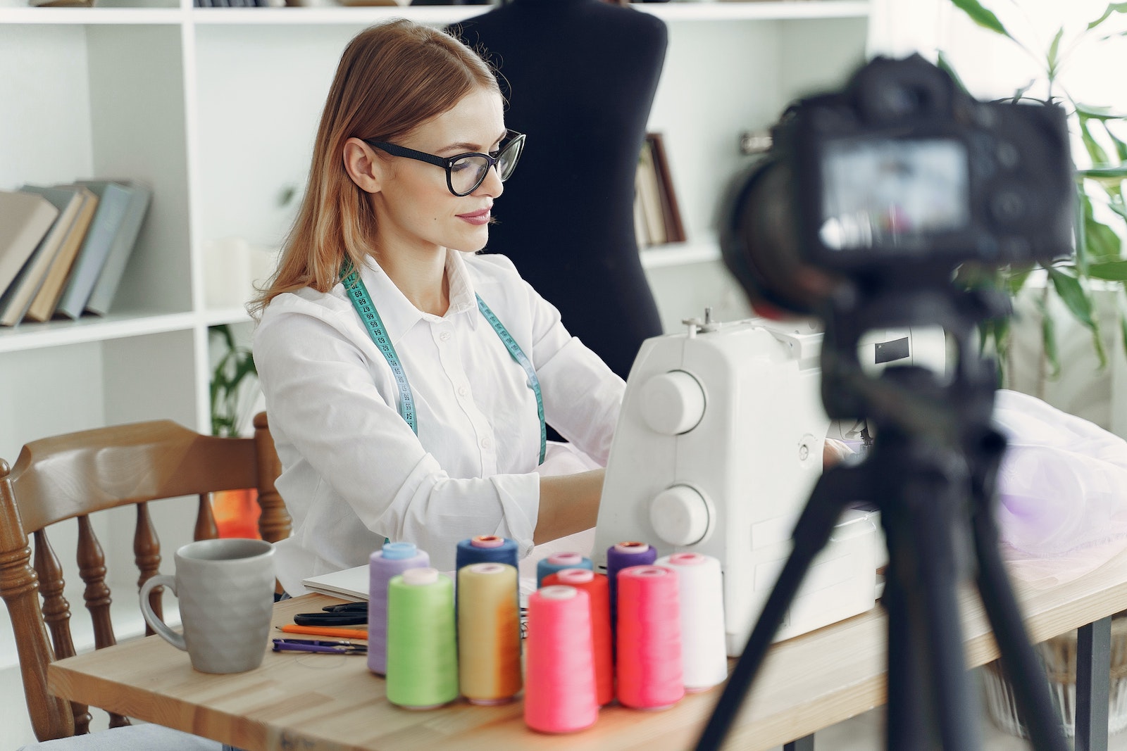 person filming in studio