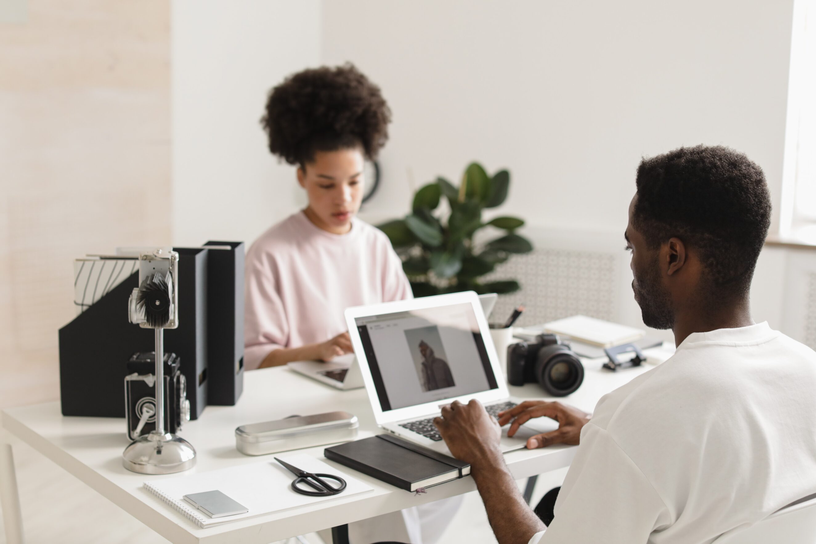 two people working at computers