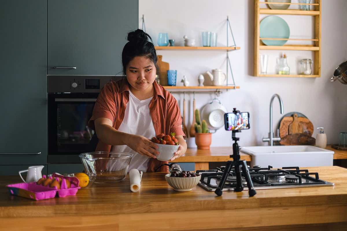 a person cooking and filming a video