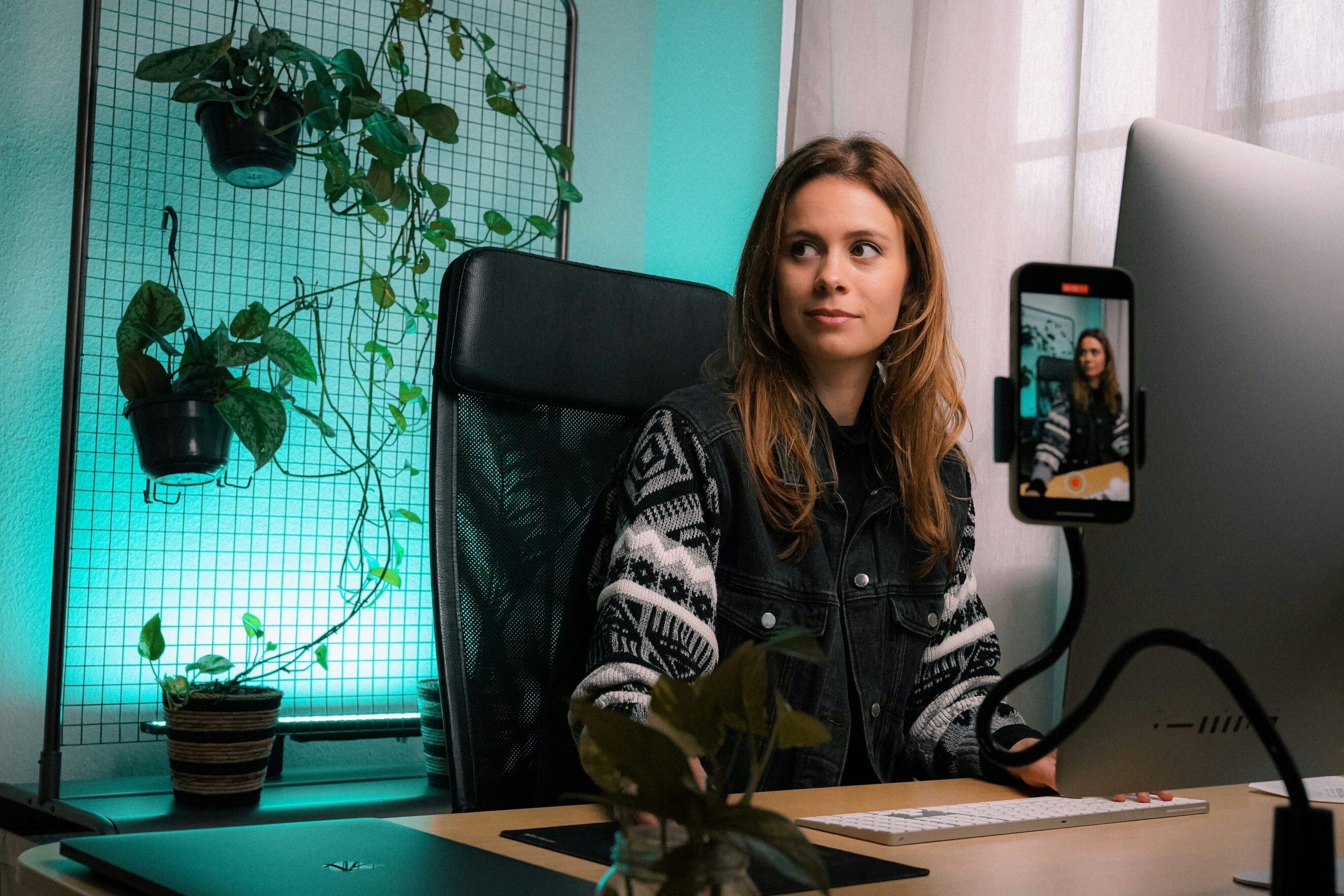 woman recording online course on youtube video on phone